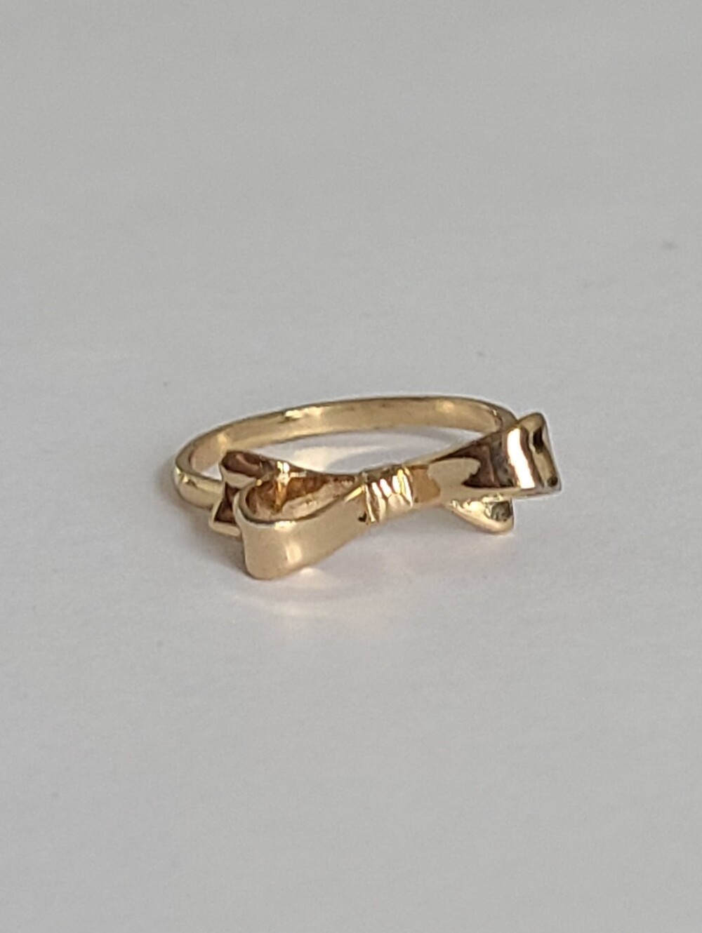 Kate Spade Designer Gold Tone Bow Thin Band Minimalist Quiet Luxury Ring